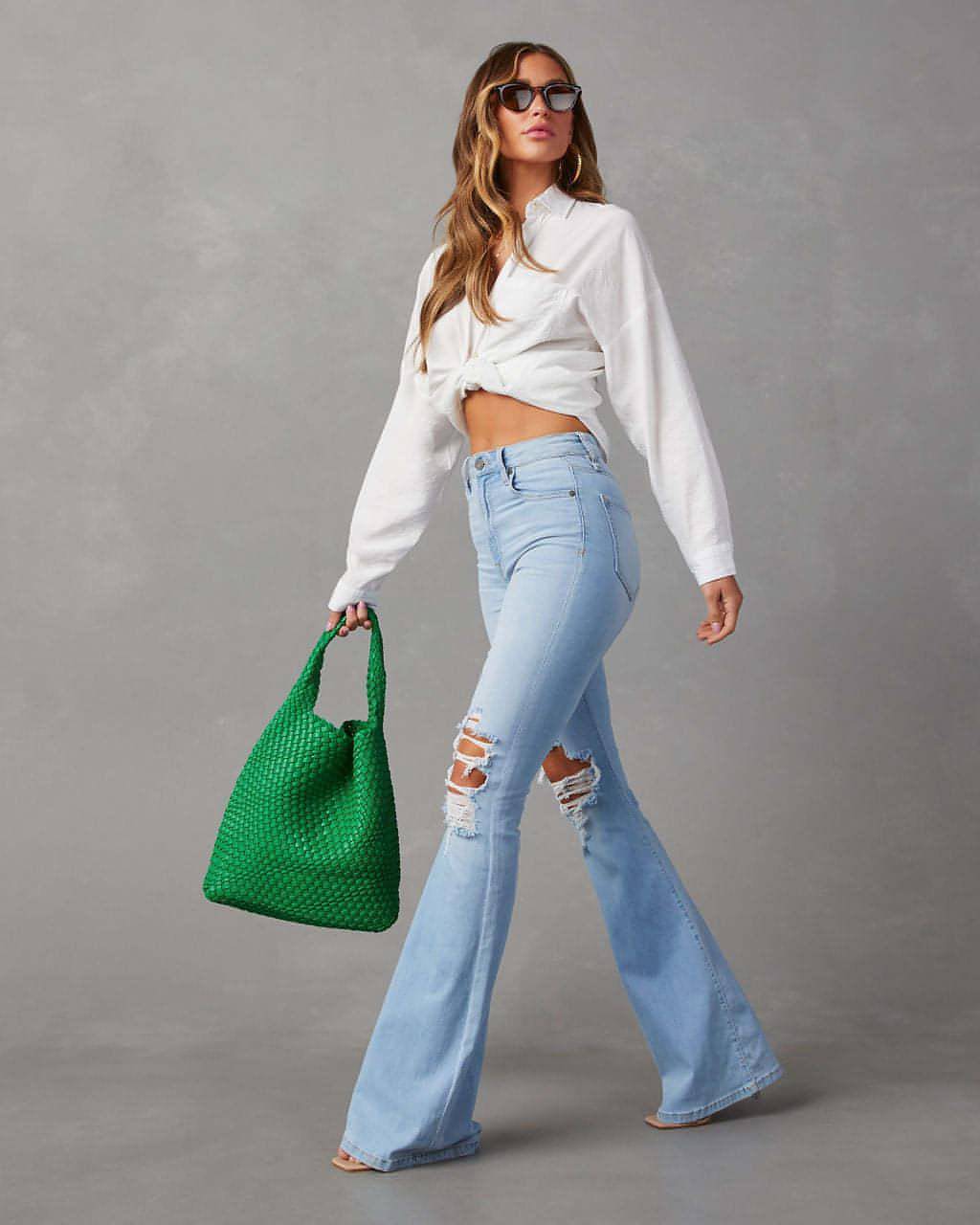 Bell Jean UrbanEase wide-leg light wash ripped denim styled with white cropped top and green bag